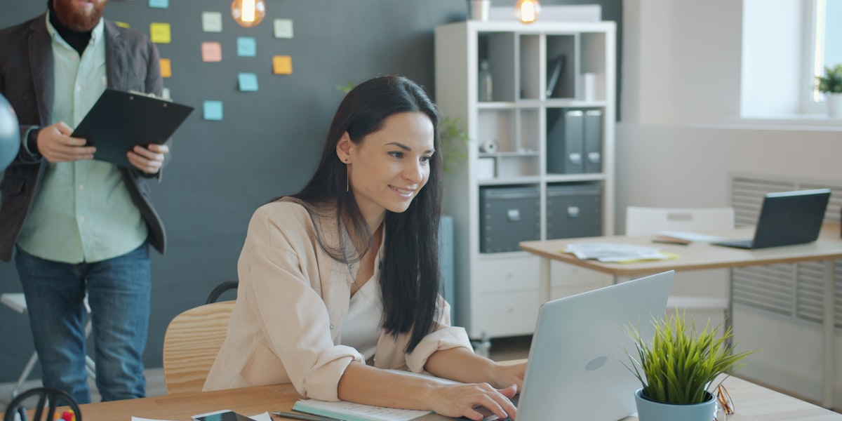 Professional reviewing business documents at a desk