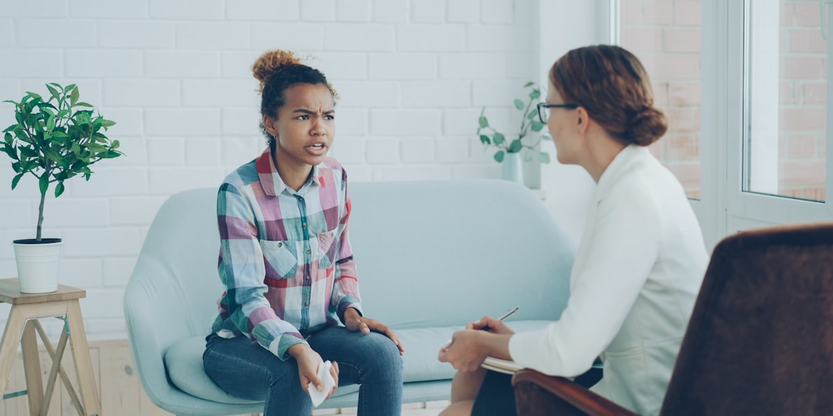 Healthcare provider reviewing clinical notes at a desk